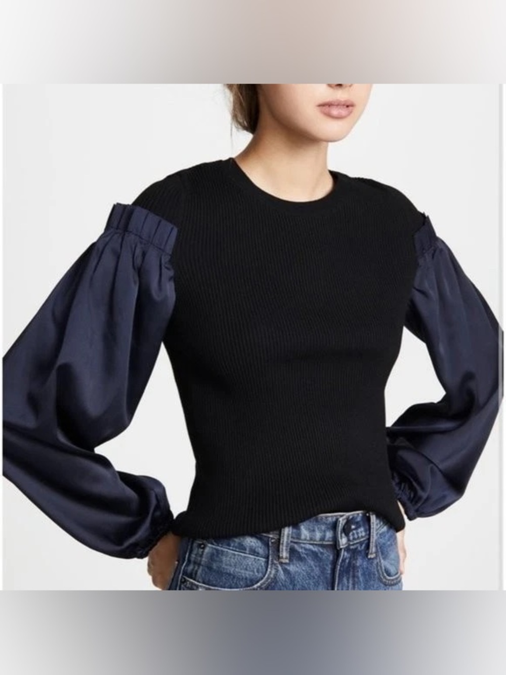 Club Monaco black ribbed knit sweater with navy puff sleeves. Size XS.